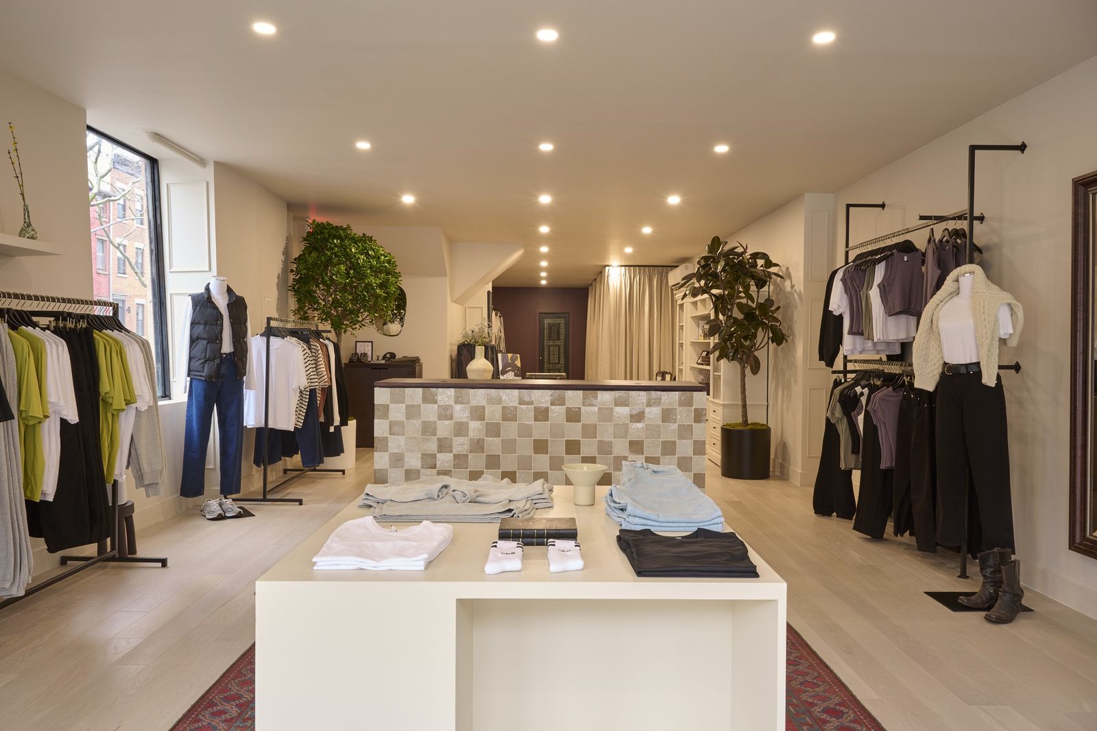 Kotn store interior — warm, clay-toned room with a tiled service counter, from the rollout Readymade supported