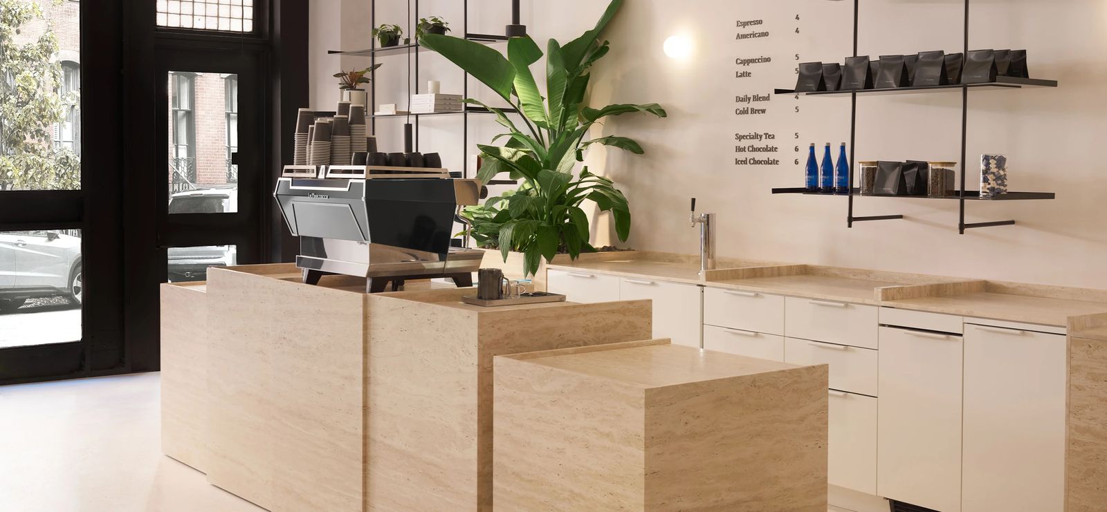 Thuma flagship interior in SoHo, New York — travertine service bar with custom millwork developed with Readymade